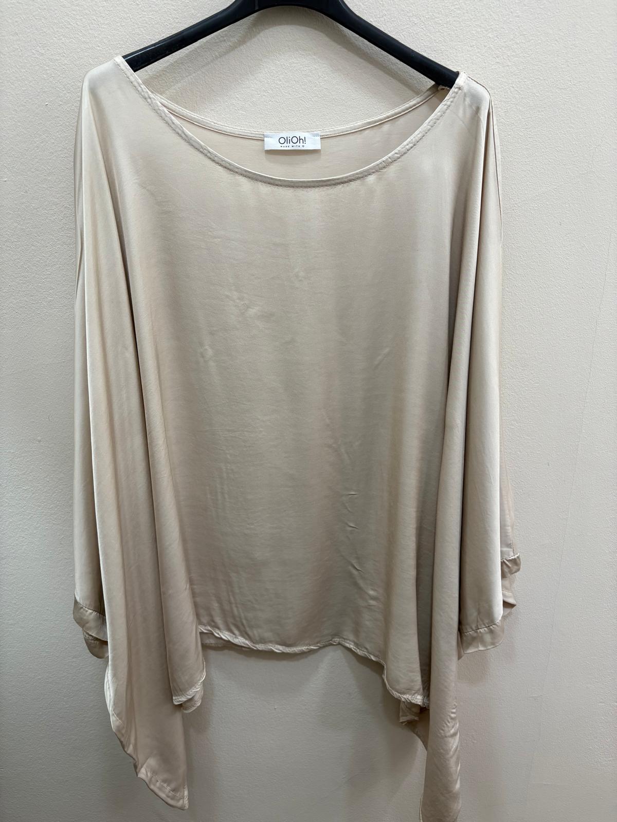 Blusa tipo capa